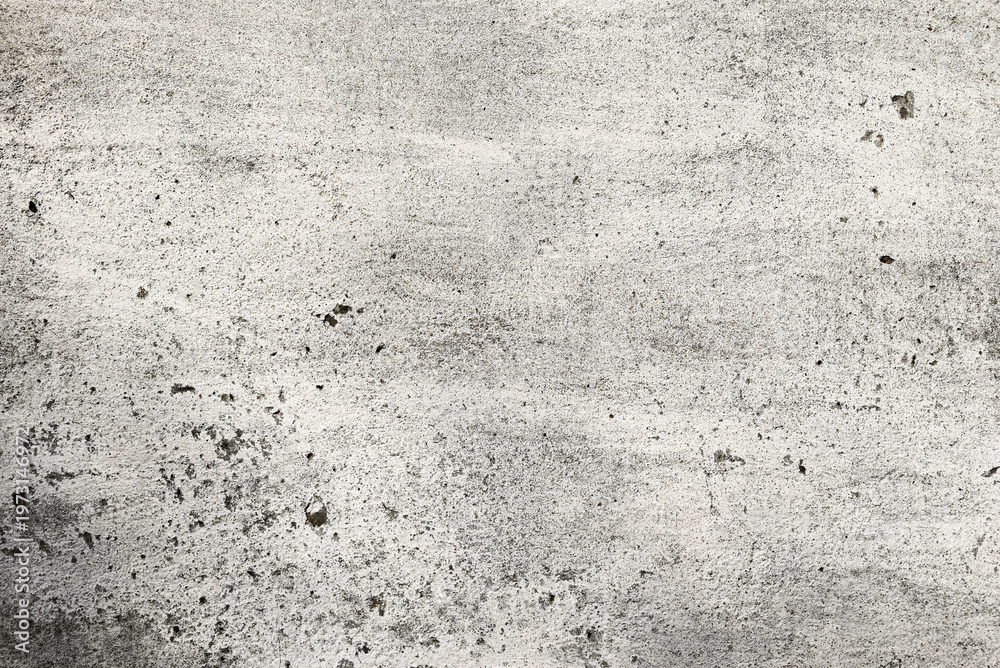 Fototapeta premium Old concrete wall with white paint. Worn surface with subtle texture, neutral grunge background for design and overlay.
