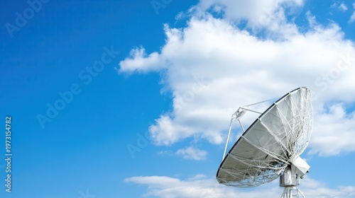 Satellite Dish Under a Blue Sky With Clouds on a Clear Day