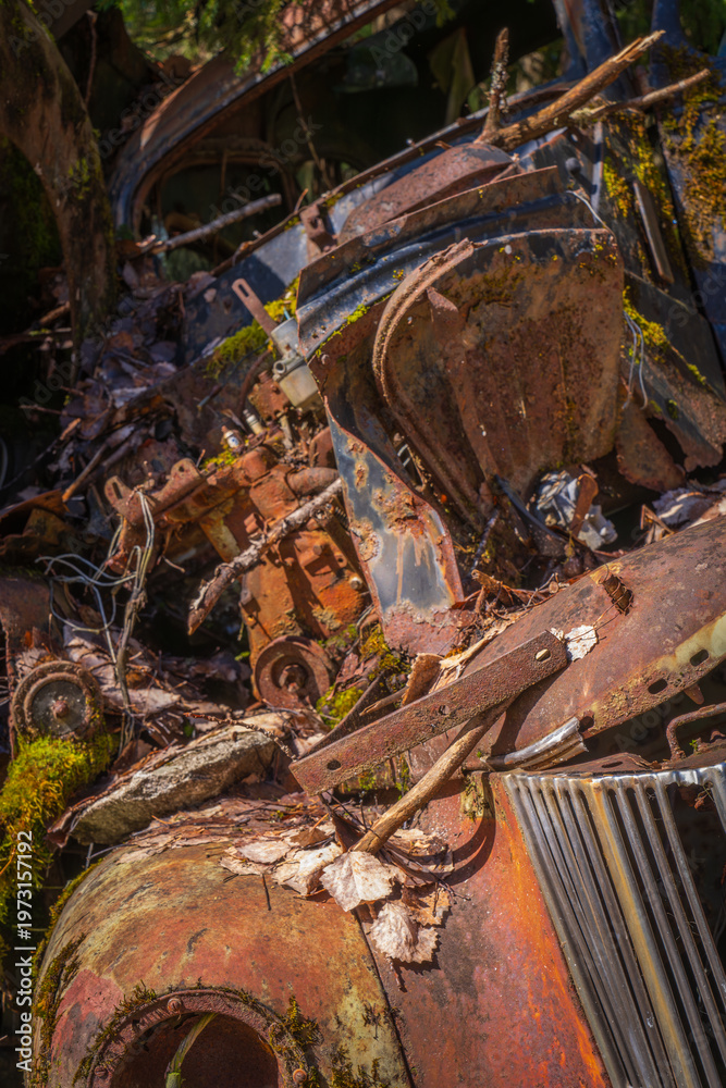 Fototapeta premium Close-up of exposed engine in abandoned vintage car