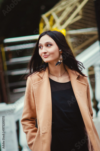 A close-up portrait of a beautiful, emotional, smiling girl. Vertical photograph.