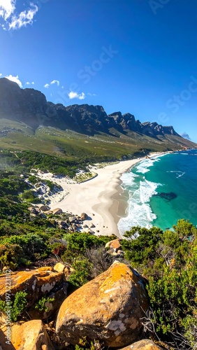 A scenic coastal landscape with a sandy beach and rocky shoreline (1)