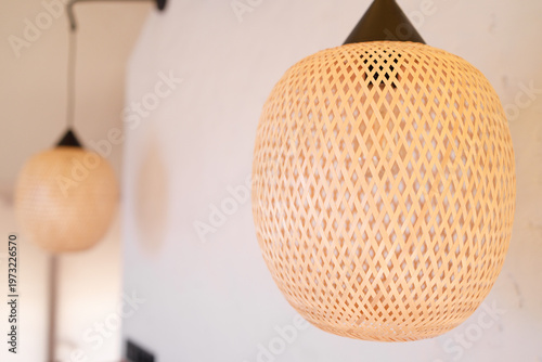 close up of woven lamp in modern interior, concept of home decor interior styling and hospitality