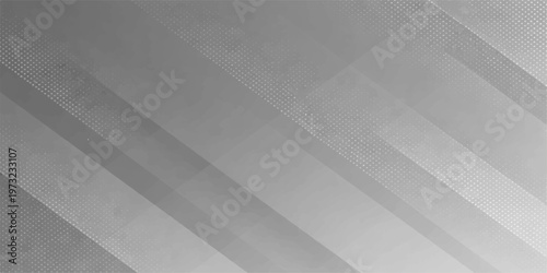 A seamless brushed metal texture background features a gray metallic steel surface with a linear pattern design for a silver aluminum backdrop or wallpaper