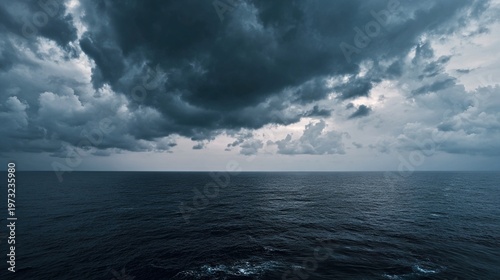 skim. A dramatic seascape at dusk with low, fast-moving clouds over a choppy ocean, an ominous storm approaching. travel magazines.