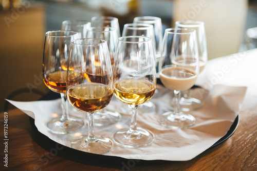 Konstfotografi Professional tasting flight of whiskey and cream liqueur in elegant Glencairn-style glasses on a tray