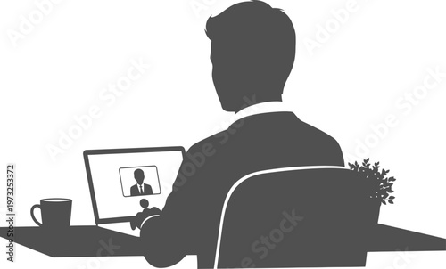 Employee viewing video call on computer from back view perspective