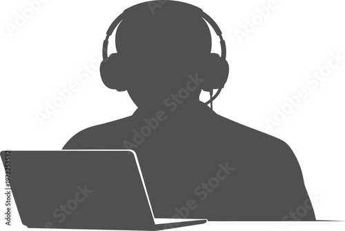 Freelancer wearing headphones working on laptop silhouette