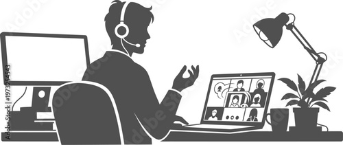 Professional man attending video conference at desk silhouette