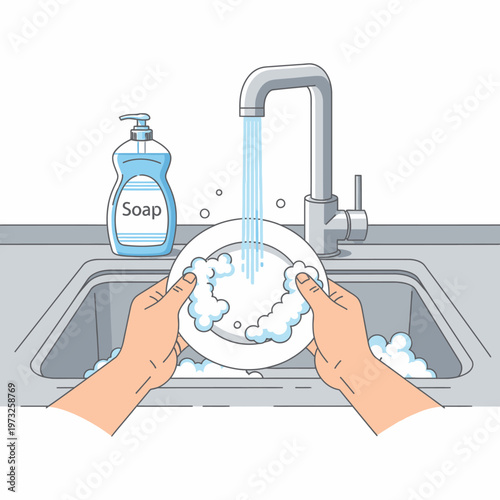 Washing dishes by hand with soap and running water in a kitchen sink