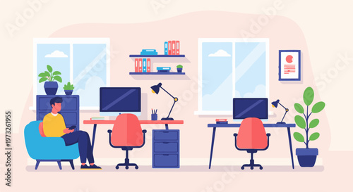 Man working on laptop in modern office setting.