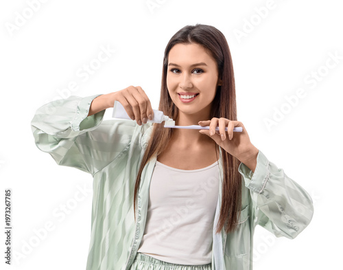 Young woman in pajamas pour...