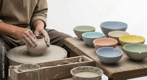 Man working on pottery wheel ceramics.