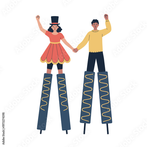 Two people balancing on stilts cheerfully raising their arms in celebration