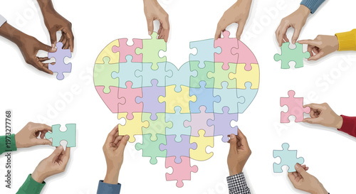 Diverse hands building heart puzzle.