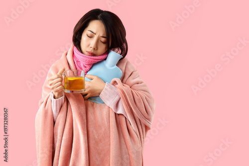 Ill young Asian woman with ...