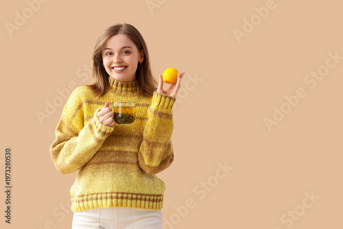 Young woman with glass cup ...