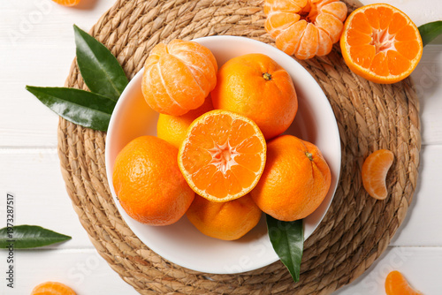 Bowl with sweet mandarins a...