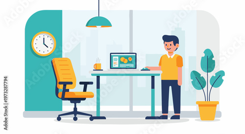 Young man standing at his desk with a laptop.