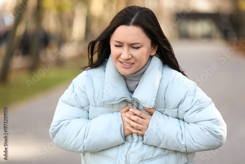 Young woman having heart at...