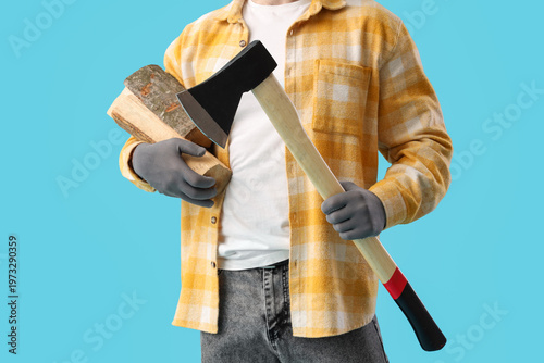 Male worker with ax and fir...