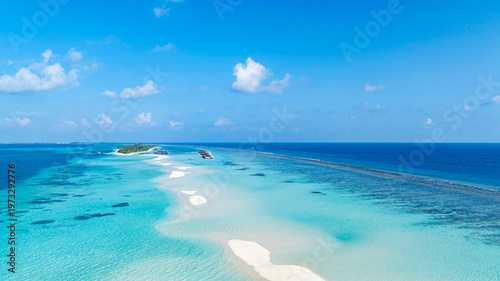 Fotografie Summer lagoon Ripples in the sand at low tide on a beach with sandbar and blue s