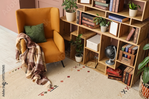 Comfortable armchair and bo...