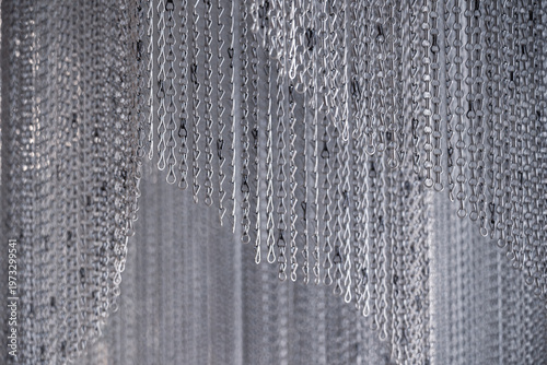 Abstract modern architecture. Metal chain curtain close up monochrome