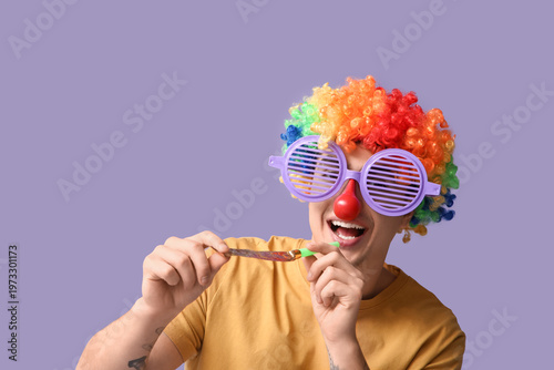 Young man in clown disguise...