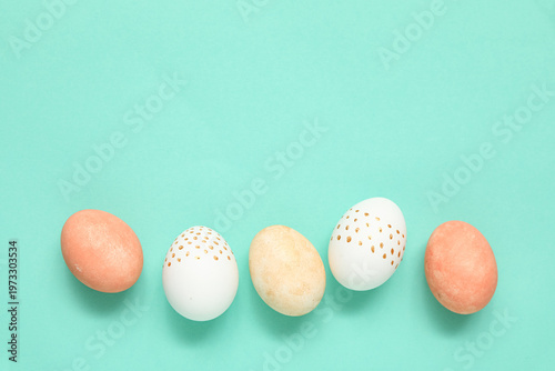 Painted Easter eggs on turq...