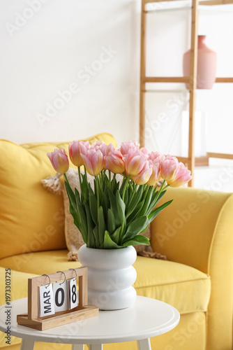 Pink tulips in white vase o...