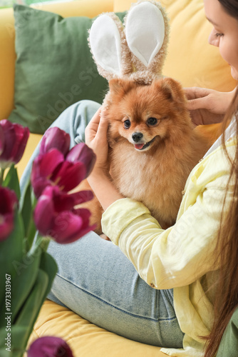 Young woman with cute Pomer...