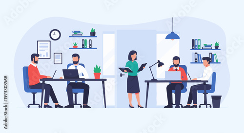 Four people working at desks in a modern office environment