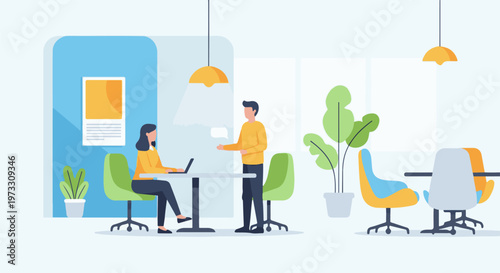 Modern office space with two individuals collaborating