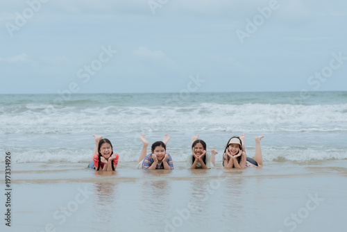 Foto Kids are splashing and having fun on swim ring floating on the sea