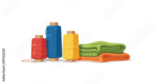 Three vibrant spools of sewing thread in primary colors stand neatly beside a soft stack of folded green and orange textile fabrics in a craft workshop.
