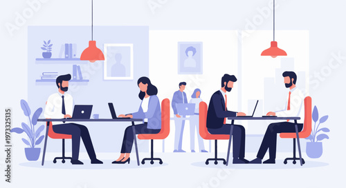 Colleagues collaborating in a modern office space, focused on their work on laptops