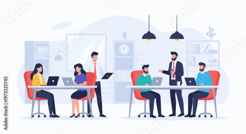 Colleagues collaborate at desks in a modern office space, focused on laptops