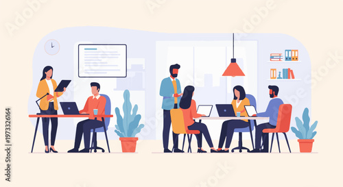 Office team collaborating on projects with laptops and digital tablets