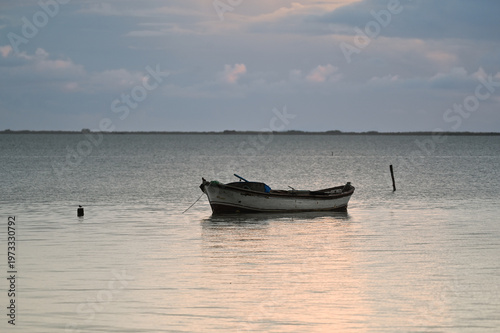 Lonely Boat on Calm Water with Soft Light – Minimal Seascape Background