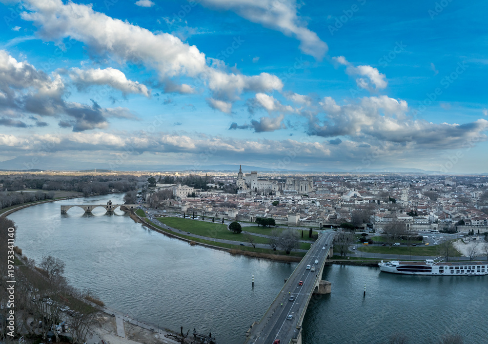 Fototapeta premium Avignon, France: Discover the Palais des Papes, the Iconic Saint-Bénézet Bridge, and the Ancient Ramparts of this Stunning UNESCO World Heritage City