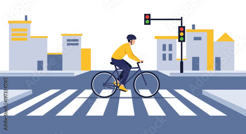 Cyclist crossing street at traffic light on pedestrian crossing in city