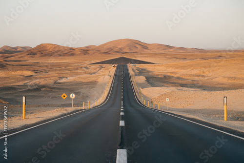 Long Desert Highway Stretching To Horizon With Sand Dunes For Travel Concepts