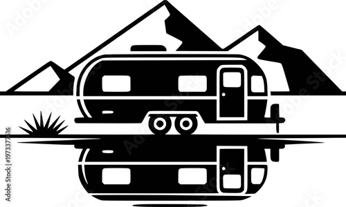 Black Silhouette of a Vintage Travel Trailer with Mountains and Reflection caravan