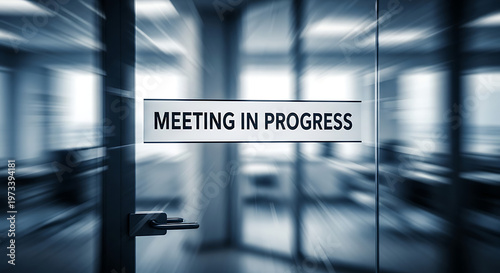 Door glass office with a 'Meeting in Progress' sign during a corporate conference, indicating a busy business schedule.