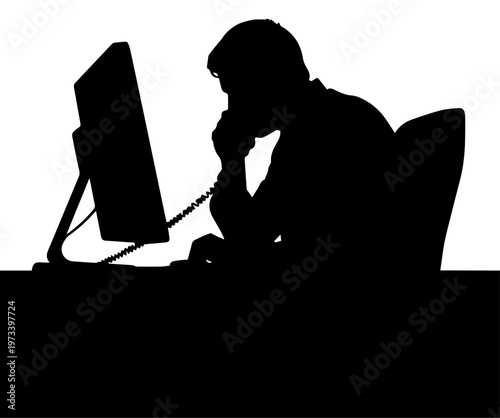 Silhouette of a businessman talking on the phone while working at a computer in an office setting