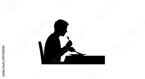 Man sitting at desk writing documents.