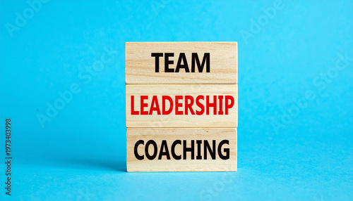 Stacked blocks with words team, leadership, coaching, symbolizing growth