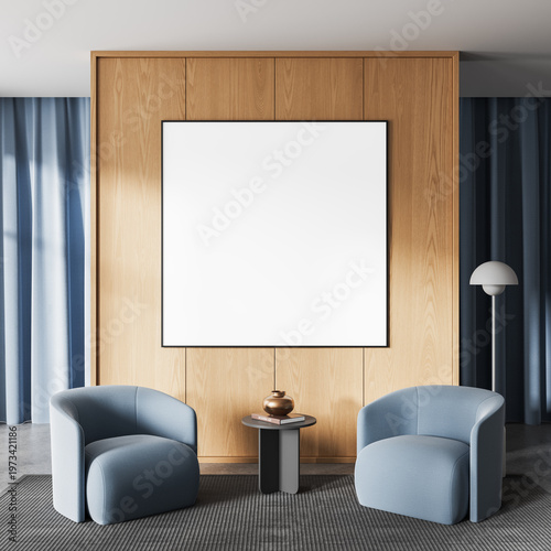 Modern interior mockup with blank framed poster on wooden wall between two blue armchairs in clean contemporary design setting. 3D Rendering
