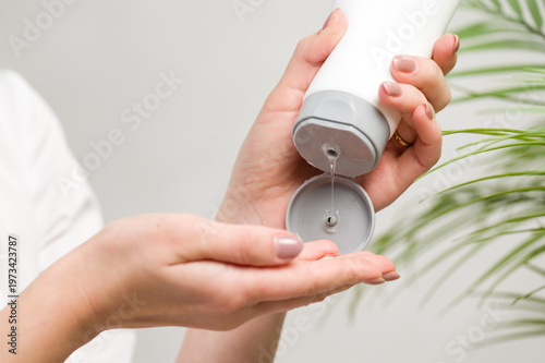 Applying cleansing gel for soft skin. Gentle skincare routine.