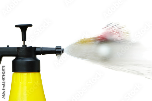 Yellow bottle portable spray water for watering plants isolated on white background
